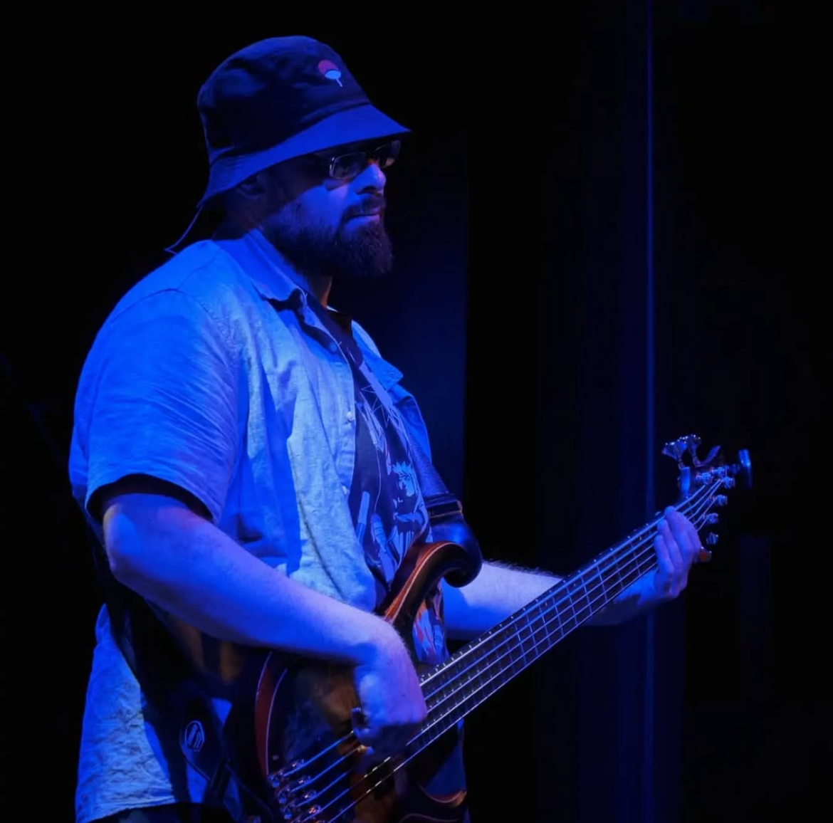 Mehmet Raif playing bass