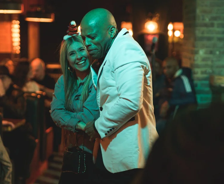 Newton Brown dancing with an audience member